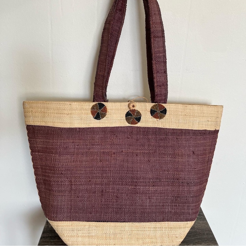 Cabernet and tan woven tote.